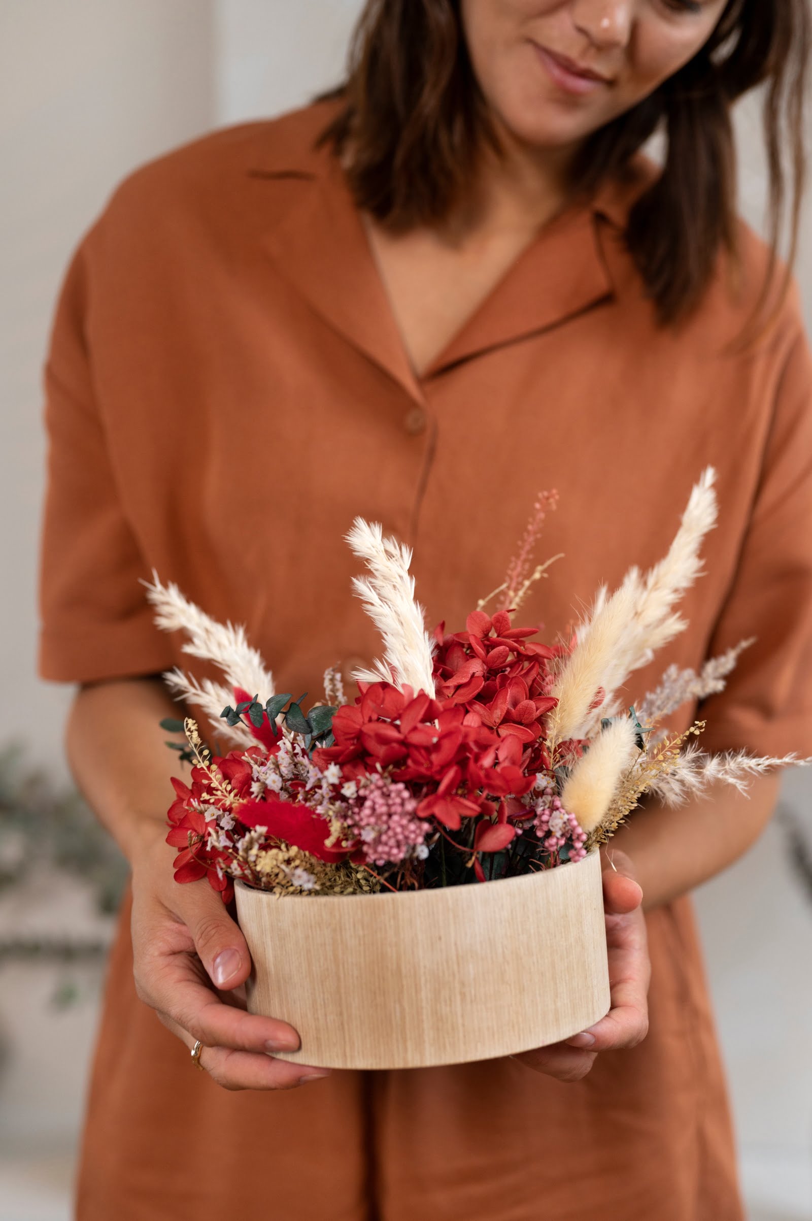 front-view-smiley-woman-holding-flowers